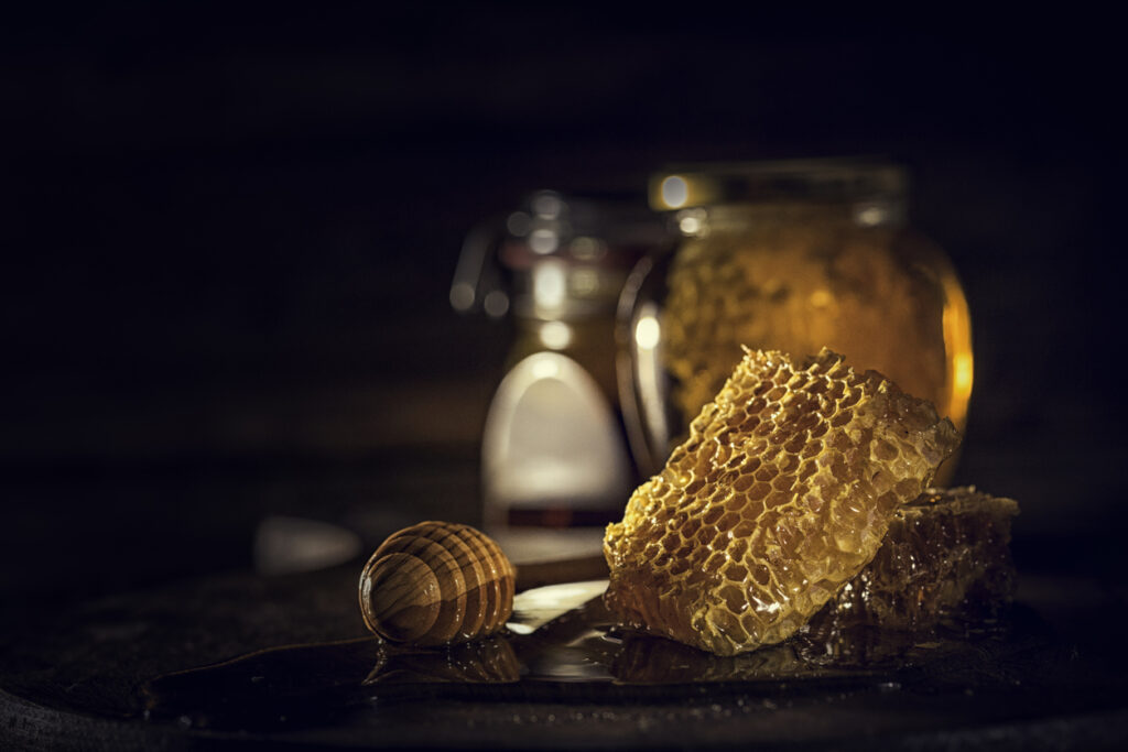 Organic honey with honeycombs in a jar